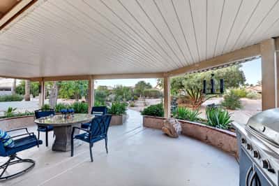 Featuring a built-in entertaining area with room for grilling and dining, this covered patio is designed for enjoying Arizona's outdoor lifestyle. Mature landscaping adds beauty and privacy.