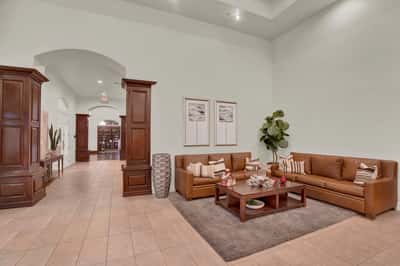 High ceilings, elegant finishes, and comfortable seating make this community lounge a welcoming destination for socializing, relaxing, and participating in neighborhood events.