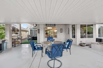 This spacious covered patio creates the ideal environment for outdoor dining and social gatherings. Durable finishes and shaded comfort make it a standout backyard feature.
