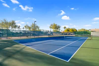 Well-maintained tennis courts provide excellent opportunities for exercise, friendly competition, and outdoor recreation within the community's amenity-rich setting.