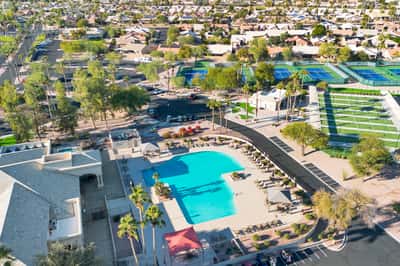This aerial perspective highlights the community pool, tennis courts, gathering spaces, and beautifully maintained grounds that contribute to an active and enjoyable lifestyle.