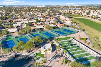 Multiple tennis courts and surrounding recreational amenities provide excellent opportunities for exercise and outdoor enjoyment. These well-maintained facilities enhance the community experience.