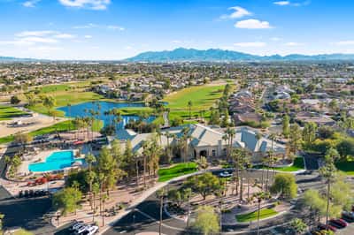 Sweeping views of the clubhouse, pool, lake, and golf course highlight the exceptional amenities and beautifully landscaped surroundings available within this desirable Goodyear community.