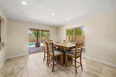 Enjoy everyday meals with beautiful views of the private patio and sparkling pool. Large windows and sliding glass doors create a bright, inviting breakfast area that perfectly complements Scottsdale indoor-outdoor living.