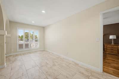 Spacious loft featuring upgraded tile flooring, plantation shutters, recessed lighting, and abundant natural light. Ideal as a home office, game room, or additional family living area.
