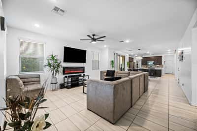 Expansive open-concept living area connecting the great room, dining space, and kitchen. The functional layout creates an inviting atmosphere perfect for gatherings and daily life.