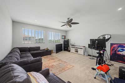 Spacious loft features plush carpeting, oversized windows, and flexible living space that easily accommodates a media room, lounge, or game room.