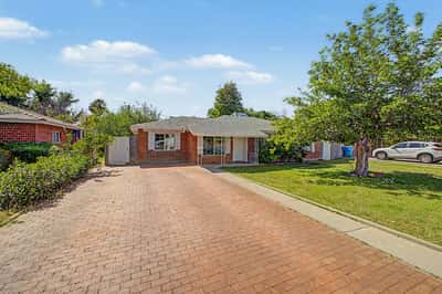 Expansive paver driveway and welcoming front entry provide excellent curb appeal and convenient parking. Mature landscaping and classic brick details complete the exterior of this Phoenix home.