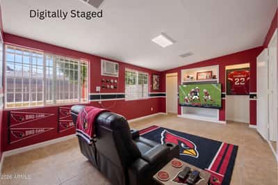 Digitally staged rendering presents the expansive flex room as a stylish entertainment lounge with theater seating and media center. This visualization demonstrates the many possibilities of this versatile space in the Phoenix home.