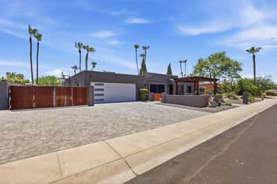 Wide paver driveway, RV gate, attached garage, and contemporary exterior create exceptional functionality and curb appeal. Thoughtful upgrades add convenience without compromising style.
