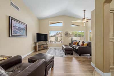 Enjoy bright, open living with vaulted ceilings, expansive windows, and updated wood-look flooring. This versatile great room provides plenty of space for entertaining or relaxing after a busy day.