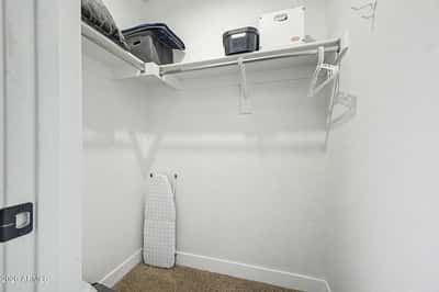 A spacious storage closet with built-in shelving provides the perfect place to organize linens, luggage, seasonal d cor, and household items, adding valuable functionality to this Goodyear rental home.