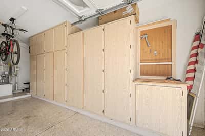 Extensive built-in cabinets and workspace make this garage ideal for storage, hobbies, or projects. Ample organization helps maximize functionality while keeping everything neatly stored.