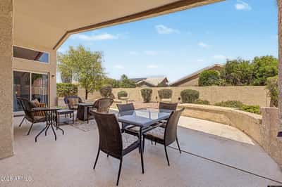 Entertain with ease beneath the large covered patio featuring multiple seating areas and attractive outdoor living space. The private backyard offers a wonderful extension of the home's interior.