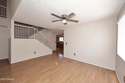 Spacious dining area offers updated flooring and an open design that flows effortlessly into the home's main living spaces, perfect for everyday dining and entertaining.