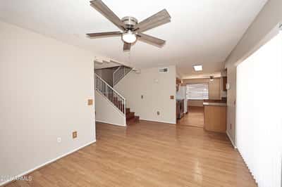Spacious family room connects effortlessly with the kitchen, creating a functional open-concept layout ideal for gathering, entertaining, and everyday comfort