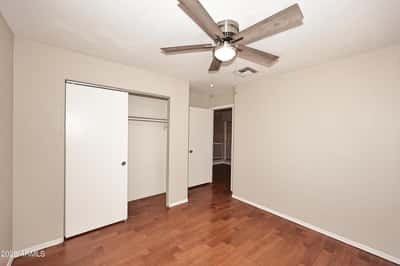 Alternate view highlights the roomy layout, closet space, and updated flooring, making this bedroom ideal for multiple living arrangements.