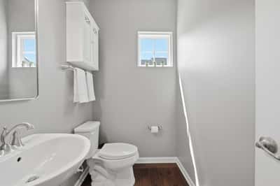 The powder room is tucked away for privacy.