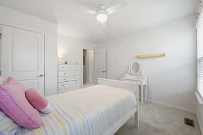 Bright and inviting bedroom featuring soft colors and modern furnishings, perfect for relaxation and comfort.