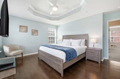 Bright and inviting bedroom featuring modern decor, a spacious layout, and ample natural light.