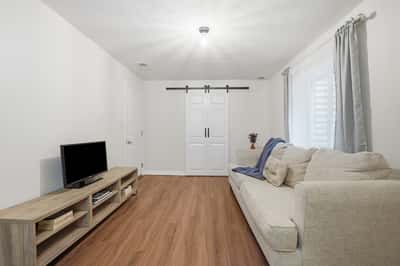Bright living area featuring modern finishes, ample natural light, and a functional layout for relaxation and entertainment.