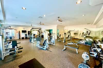 Bright and spacious gym featuring a variety of modern equipment for all fitness levels.