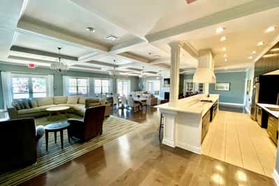 Spacious open-concept living area featuring modern finishes, ample natural light, and inviting social spaces for gatherings.