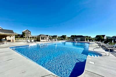 Experience leisure living with this expansive pool area, perfect for relaxation and social gatherings.
