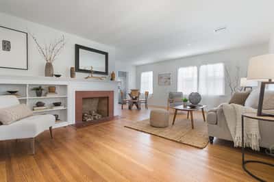 Living room with fireplace, built in shelving
