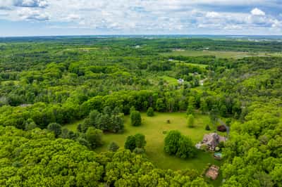 Spacious property featuring expansive greens and distant views, perfect for building your dream home and enjoying nature.
