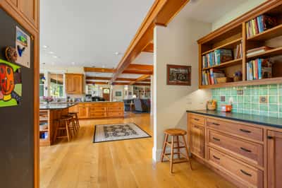Bright and inviting kitchen seamlessly connects to a spacious living area, perfect for entertaining and everyday living.