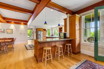 Bright and inviting kitchen features a spacious island, perfect for casual dining and entertaining.