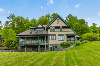 Spacious home with expansive lawns and abundant greenery, perfect for outdoor living and relaxation.