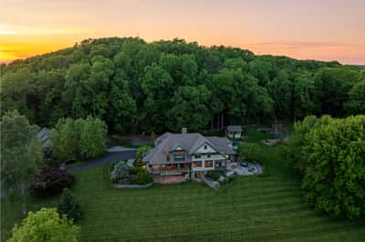 Nestled in lush surroundings, this spacious home offers stunning views and ample outdoor living space.