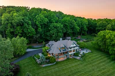 Nestled in lush greenery, this captivating home offers privacy and tranquility, perfect for nature lovers.