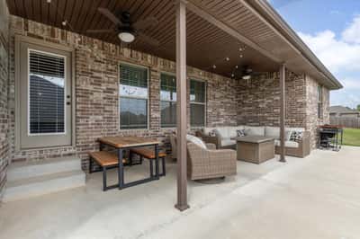 Spacious outdoor living area perfect for entertaining or relaxing in the shade.
