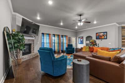 Spacious living area with a cozy fireplace, perfect for gatherings.