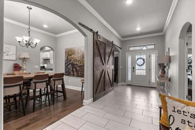 Inviting entryway features an open layout with modern finishes.