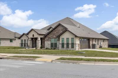 Spacious modern home featuring attractive landscaping and ample natural light in a vibrant neighborhood.