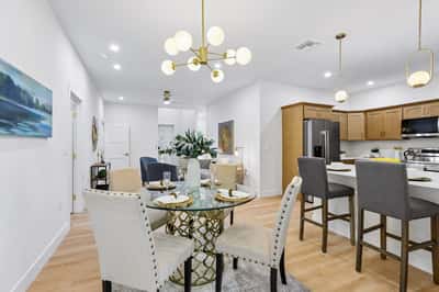 Bright and welcoming open-concept dining and kitchen area, perfect for entertaining and everyday living.