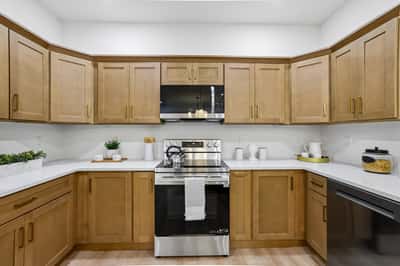 Modern kitchen featuring sleek appliances, ample cabinetry, and a functional layout perfect for everyday cooking.