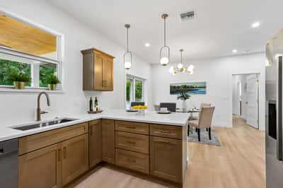 Modern kitchen featuring sleek cabinetry, ample natural light, and an open layout perfect for entertaining.