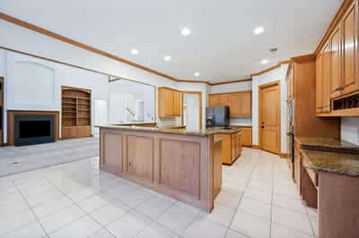 Spacious kitchen featuring ample cabinetry, modern appliances, and an open layout connecting to the living area.