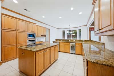 Spacious kitchen featuring abundant cabinetry, new appliances, and ample counter space for cooking and entertaining.