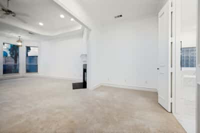 Bright and spacious living area with large windows, offering ample natural light and versatile layout options.
