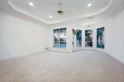 Spacious primary bedroom with natural light and easy access to outdoor space.