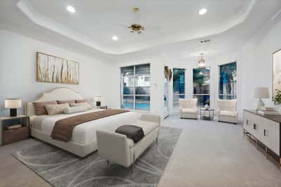 Spacious master bedroom boasts ample natural light with direct access to a private outdoor area.