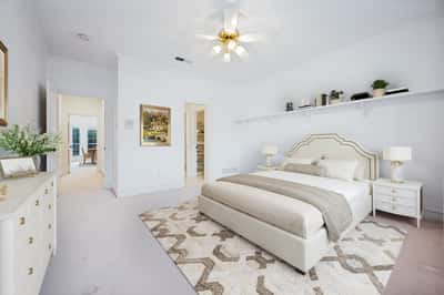 Spacious bedroom featuring natural light, a cozy layout, and seamless access to adjoining rooms.