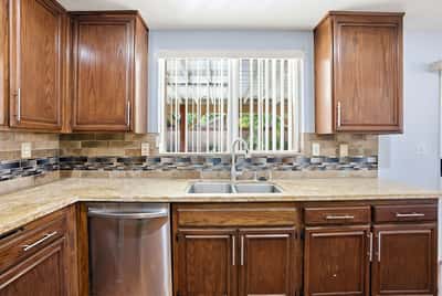 This well-appointed kitchen features ample storage, modern finishes, and a bright, inviting atmosphere.