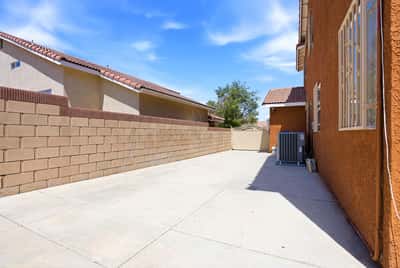 Spacious side yard offers ample room for outdoor projects or additional parking options.
